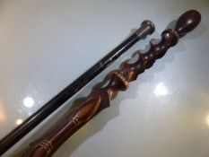 Hallmarked silver topped and ebonised cane, along with an african carved cane.