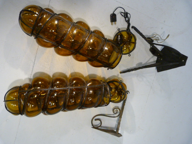 Wall lights - pair of amber twist glass wall lights or to be made into one light fittings .