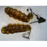 Wall lights - pair of amber twist glass wall lights or to be made into one light fittings .