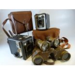 Two Kodak brownie cameras in cases, Pair of Opera Glasses, and one other Military type binoculars