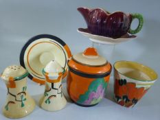 Clarice Cliff china to include Jam pot, Pot, Salt and Pepper etc and a Cup and Saucer in the form of