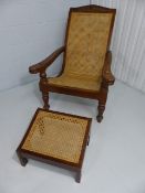 A 20th Century Plantation/Bergere chair with a slide out arms