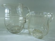 19th Century Glass bulbous water jug with bubble flecks throughout. Along with one other similar