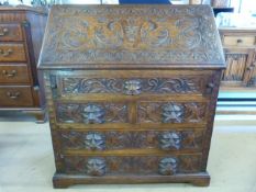 Greenman Oak carved Bureau with various drawers