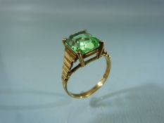 9ct ring set with single bright Green coloured Stone