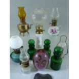 Selection of miniature glass and porcelain oil lamps