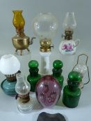 Selection of miniature glass and porcelain oil lamps