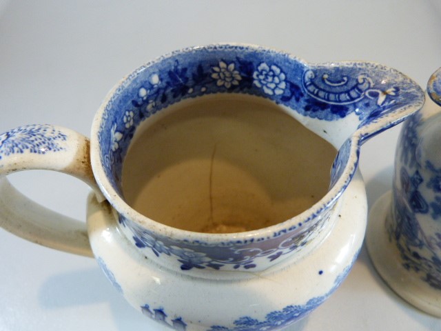 Pearlware - a pair of Antique c. 1825 transfer blue and white pouring jugs - printed with - Image 8 of 11