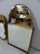 Arts and crafts shaped mirror with partial carved wooden frame