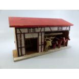 Erzgebirge German Democratic Republic carved wooden toy. CWW1 Stable block, with horses, cow and