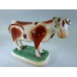 Early 19th Century Staffordshire Cow Creamer (missing lid).