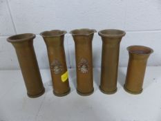 Four pieces of Trench art with Regiment badges