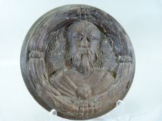 Wooden Religious Icon. Circular wall plaque depicting a religious man surrounded by a wreath.