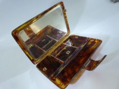 Tortoise shell cased ladies dress purse, with comb and mirror