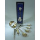 Set of four hallmarked silver teaspoons with the handles depicting Clubs, Diamonds, Spades and