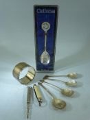 Set of four hallmarked silver teaspoons with the handles depicting Clubs, Diamonds, Spades and