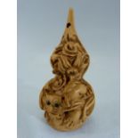 Japanese carved wooden Netsuke - carved with dragons. Marked to base.