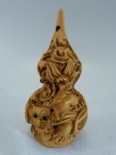 Japanese carved wooden Netsuke - carved with dragons. Marked to base.