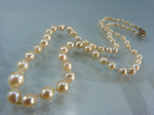 Cultured Pearl necklace with Graduating beads and a 14k gold clasp.