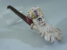 A Gambier mould clay pipe bowl, coloured enamel decoration of Jacob with wooden stem