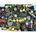 Military: Large collection of Naval and military insignia including cap badges, arm bands, hat