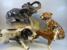 Four large animal figures to include a Tiger, Spaniel, Elephant and a Beswick boxer