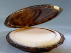 Tortoise shell cased powder compact