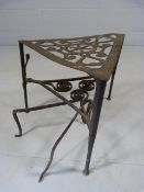 Georgian wrought iron trivet on pad feet with pierced design on top along with a simple swedish fire