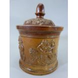 Brampton Pottery - Salt Glaze circular jar depicting various raised scenes of a man smoking a Pipe