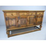 Oak sideboard with carved 4 draws and 4 cupboards