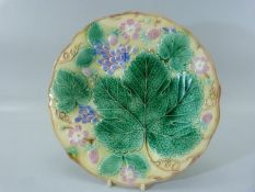 Wedgwood Majolica dessert plate decorated with leaves, fruit and flowers. Impressed stamp to back
