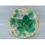 Wedgwood Majolica dessert plate decorated with leaves, fruit and flowers. Impressed stamp to back