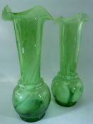 Pair of Glass bulbous bodied and flared neck with wavy rims. Green glass with white glass flecks