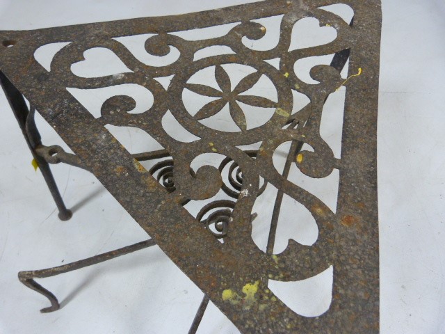 Georgian wrought iron trivet on pad feet with pierced design on top along with a simple swedish fire - Image 4 of 7