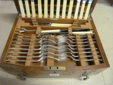 Cased canteen of various silver plated cutlery with lidded top and drawer under.