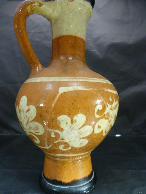 Slipware terracotta colour jug with red and cream decoration in the form of simplistic flowers, - Image 3 of 5