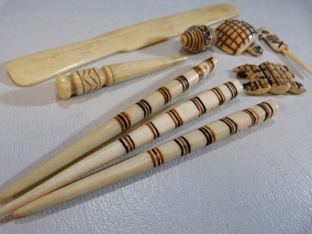 Carved bone African pendants, paper knife etc - Image 4 of 5