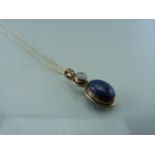Scottish style Pendant set with Lapis Lazuli and a moonstone on silver chain