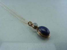 Scottish style Pendant set with Lapis Lazuli and a moonstone on silver chain