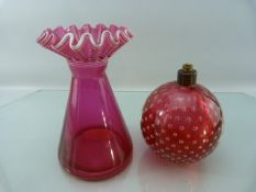 Whitefriars style controlled bubble lamp base and a crimped triangular glass vase. Both in Ruby