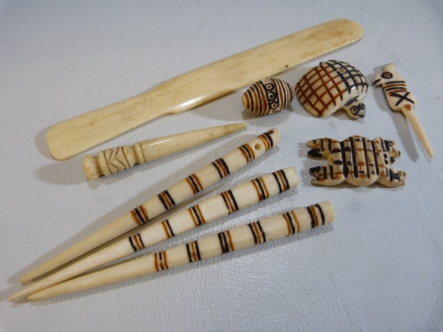 Carved bone African pendants, paper knife etc - Image 5 of 5