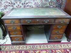 Antique pedestal mahogany desk with tooled leather inlay