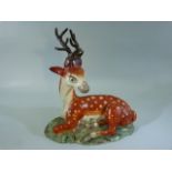 Staffordshire Pearlware figure of a Recumbent stag. C.1820's. Deer with large amount of restoration.