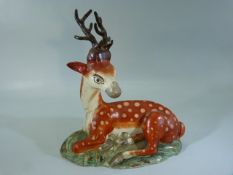 Staffordshire Pearlware figure of a Recumbent stag. C.1820's. Deer with large amount of restoration.