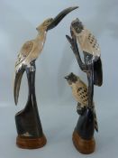 Pair of carved Horn figures of Birds on plinths