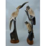 Pair of carved Horn figures of Birds on plinths