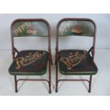 Pair of metal folding chairs with Pepsi logo
