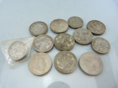 Three Pre-1935 One Florins, and a selection of crowns