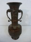 Chinese / Japanese bronze vase. Pear shaped body with waisted neck. Decorated in relief with birds