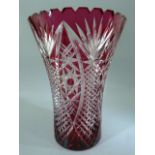 Bohemian crystal cranberry flash overlay glass vase with star cut base.